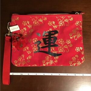 Kipling Red and Gold Floral Wristlet